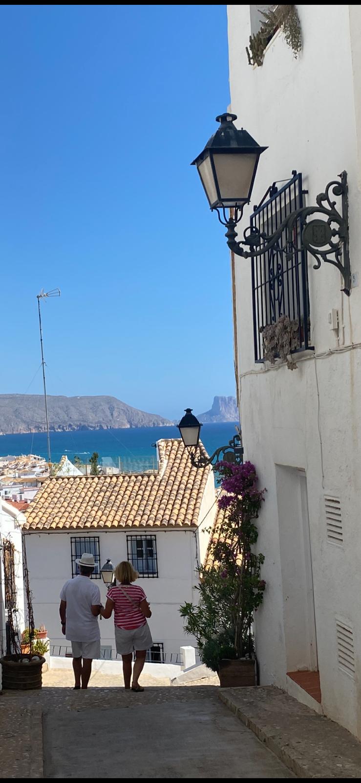 A lovely photo from Phil of Eladio and I with our backs to the camera in Altea walking in the sun last September